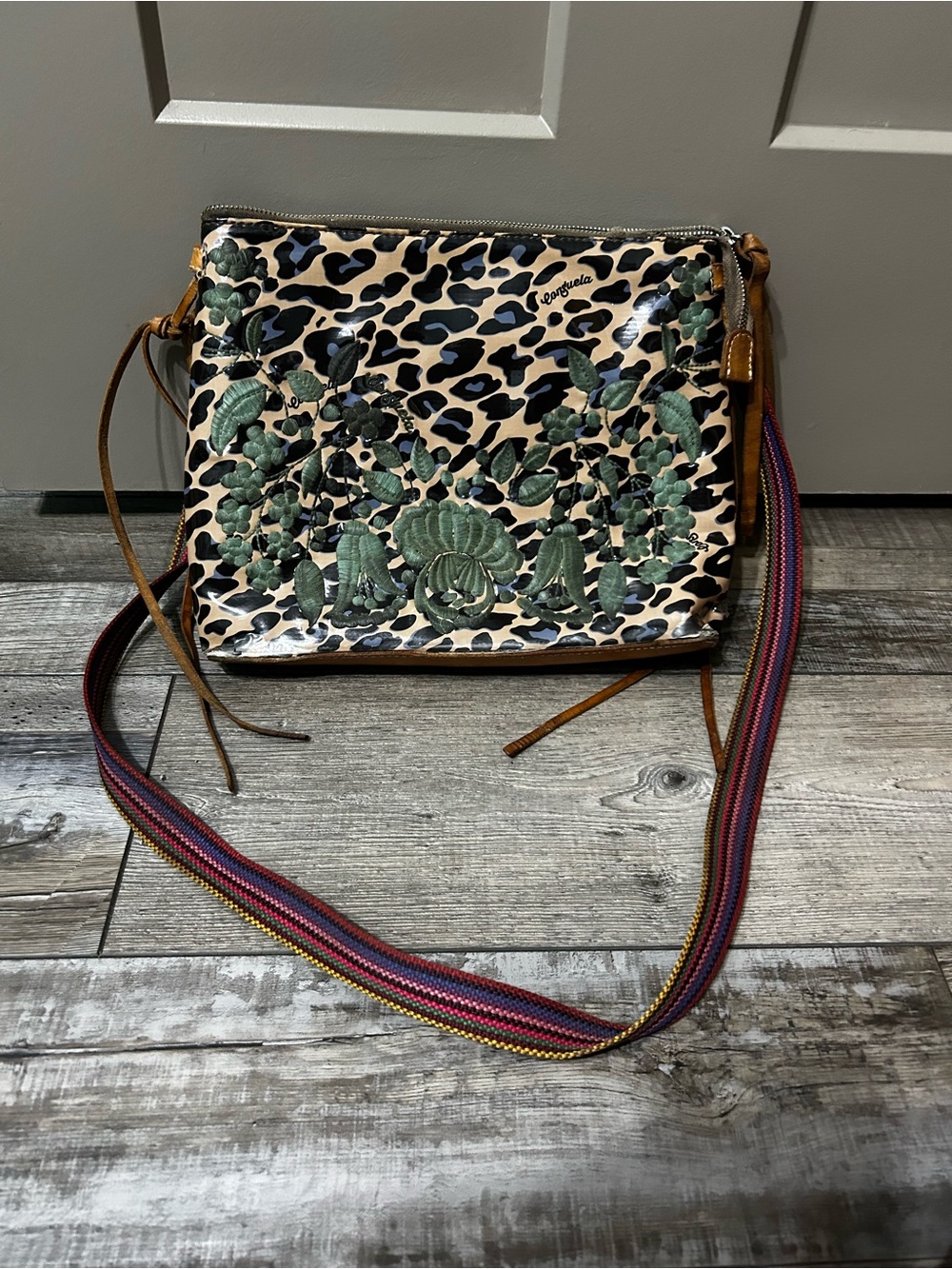 Consuela Bettie Downtown Crossbody, featuring a blue jaguar leopard print - flaw
